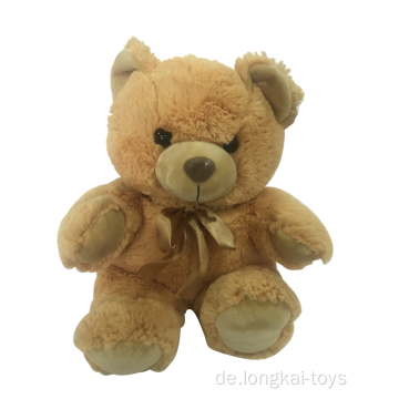 Plüsch-Teddybär im goldenen Bogen
